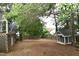 A spacious backyard with green grass, a playhouse, and a fenced yard offers outdoor enjoyment at 3209 Leebrook Rd, Raleigh, NC 27616