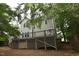Large backyard with a spacious deck for relaxing and entertaining, perfect for outdoor gatherings at 3209 Leebrook Rd, Raleigh, NC 27616