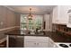 Bright kitchen with stainless steel appliances, granite countertops, and stainless sink at 3209 Leebrook Rd, Raleigh, NC 27616