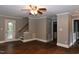 Open living area with hardwood floors, stairs, back door and neutral paint at 3209 Leebrook Rd, Raleigh, NC 27616