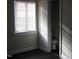 Bright bathroom featuring a toilet and window with white trim at 3514 S Alston Ave, Durham, NC 27713