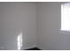 Bright bedroom featuring a window with wooden trim and dark floors at 3514 S Alston Ave, Durham, NC 27713