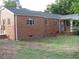 Exterior shot of a single-story red brick home with a covered front porch at 3514 S Alston Ave, Durham, NC 27713