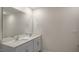 Bright bathroom features a double vanity with plenty of storage space and a large mirror at 416 Ember St, Sanford, NC 27330