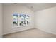 Sunny bedroom with a large window overlooking a neighborhood at 416 Ember St, Sanford, NC 27330