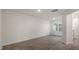 Open concept living room with light walls, recessed lighting and wood-look floors at 416 Ember St, Sanford, NC 27330