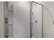 Modern shower featuring a glass enclosure and convenient built-in shelves at 416 Ember St, Sanford, NC 27330