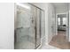 Modern bathroom features a marble tiled shower with glass doors and a convenient built-in bench at 512 Courtship Cv, Durham, NC 27703
