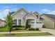 Charming single Gathering home with two-car garage, welcoming porch and manicured landscaping at 512 Courtship Cv, Durham, NC 27703