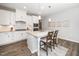 Well-lit kitchen featuring white cabinets, granite countertops, and stainless steel appliances at 512 Courtship Cv, Durham, NC 27703