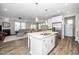 Bright, open-concept kitchen and living space, with kitchen island and modern appliances at 512 Courtship Cv, Durham, NC 27703