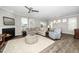 Open-concept living room features a fireplace, hardwood floors, and neutral color palette at 512 Courtship Cv, Durham, NC 27703