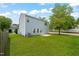 Spacious backyard with a well-maintained lawn and a light-blue two-story home at 518 Clearfield Dr, Durham, NC 27703