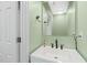 Stylish bathroom with a white vanity, updated fixtures, and neutral-colored walls at 518 Clearfield Dr, Durham, NC 27703