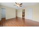 Bedroom with hardwood floors and a view of the ensuite bathroom and walk-in closet at 518 Clearfield Dr, Durham, NC 27703