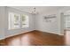 Dining room featuring hardwood floors, a chandelier, and a view of the kitchen at 518 Clearfield Dr, Durham, NC 27703