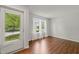 Bright, airy living room with hardwood floors and natural light from the windows at 518 Clearfield Dr, Durham, NC 27703