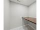 Compact office features a wooden countertop desk and neutral-colored walls at 518 Clearfield Dr, Durham, NC 27703