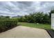 Landscaped backyard with patio and lush green space, perfect for outdoor living and entertaining at 545 Writers Way, Morrisville, NC 27560