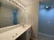 Bathroom features a large mirror, vanity, and sink at 545 Writers Way, Morrisville, NC 27560