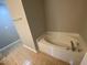 A bathtub with tile floors offers a clean space for relaxing at 545 Writers Way, Morrisville, NC 27560