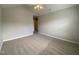 This room is carpeted with ceiling fan and vaulted ceilings at 545 Writers Way, Morrisville, NC 27560