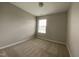 Bedroom showcasing neutral carpeting and a window at 545 Writers Way, Morrisville, NC 27560