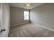 Bedroom showcasing neutral carpeting and a window at 545 Writers Way, Morrisville, NC 27560