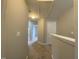 Upstairs hallway featuring neutral carpeting, paint and lighting at 545 Writers Way, Morrisville, NC 27560