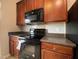 Well-equipped kitchen features stainless steel appliances and ample wood cabinetry at 545 Writers Way, Morrisville, NC 27560