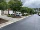 Exterior view of the house showing the neighborhood street, sidewalk, and neighboring houses at 545 Writers Way, Morrisville, NC 27560