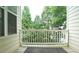 View from the balcony showcasing lush greenery and mature trees at 5916 Longeria Ct, Raleigh, NC 27612