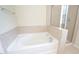 Spacious bathroom featuring a soaking tub and a separate glass-enclosed shower at 5916 Longeria Ct, Raleigh, NC 27612