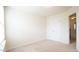 Bedroom with neutral carpet, light walls and a closet at 5916 Longeria Ct, Raleigh, NC 27612