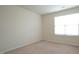 Bedroom with neutral carpet, light walls and a bright window at 5916 Longeria Ct, Raleigh, NC 27612