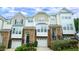 Charming townhome with stone accents, attached garages, and inviting curb appeal at 5916 Longeria Ct, Raleigh, NC 27612
