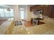 Kitchen features stainless appliances, granite counters, and a convenient breakfast bar at 5916 Longeria Ct, Raleigh, NC 27612