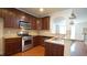 Kitchen features stainless appliances, granite counters, and a convenient breakfast bar at 5916 Longeria Ct, Raleigh, NC 27612