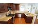 Kitchen features stainless appliances, granite counters, and a convenient breakfast bar at 5916 Longeria Ct, Raleigh, NC 27612