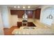 Beautiful kitchen featuring granite countertops, stainless steel appliances and hardwood floors at 5916 Longeria Ct, Raleigh, NC 27612
