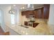 Kitchen features stainless appliances, granite counters, and a convenient breakfast bar at 5916 Longeria Ct, Raleigh, NC 27612