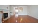 Spacious living room featuring a fireplace and archway to kitchen at 5916 Longeria Ct, Raleigh, NC 27612
