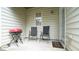 Cozy back patio featuring a grill and seating, perfect for outdoor entertaining at 5916 Longeria Ct, Raleigh, NC 27612
