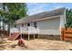 Home's back exterior showcasing deck with stairs and backyard at 612 Agin Court Pl, Clayton, NC 27520