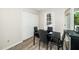 Dining area featuring a black dining set near a window and closet at 612 Agin Court Pl, Clayton, NC 27520