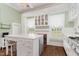 Charming kitchen with a central island, abundant white cabinets, and lots of natural light at 6200 Us-401 S, Bunnlevel, NC 28323