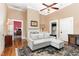 Comfortable living room boasts hardwood floors, high ceilings, a ceiling fan, and fireplace at 6200 Us-401 S, Bunnlevel, NC 28323