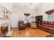 Elegant living room with cozy seating, fireplace, and hardwood floors at 6200 Us-401 S, Bunnlevel, NC 28323