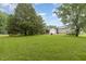 Expansive backyard featuring a storage shed and lush green lawn at 6408 Glen Brack Ct, Raleigh, NC 27603