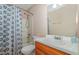 Cozy bathroom features a shower-tub combo with a stylish blue patterned shower curtain and single sink at 6408 Glen Brack Ct, Raleigh, NC 27603